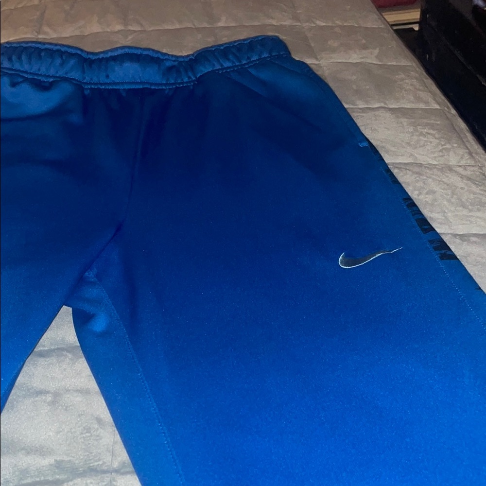 Nike Blue Sweatpants with Elastic Waistband and Soft Fleece Material